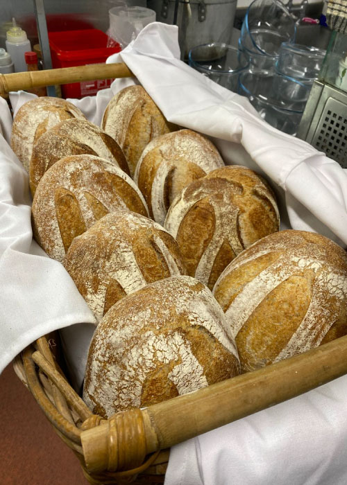 Basket of nine loafs of sourdough from The Ash Pub in Stansted.